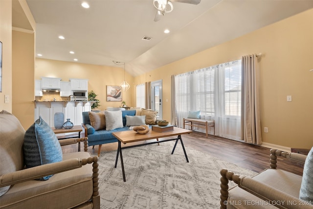 living room with ceiling fan and light hardwood / wood-style floors