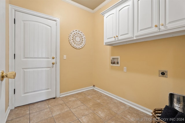 laundry room with cabinets, hookup for a washing machine, ornamental molding, electric dryer hookup, and light tile patterned floors