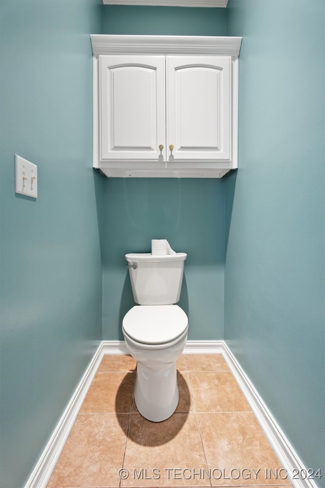 bathroom featuring toilet and tile patterned floors