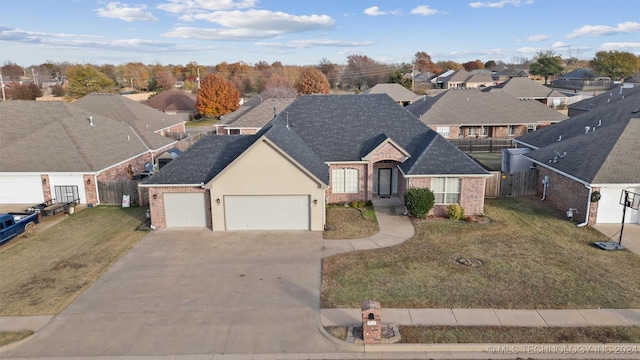 view of front facade with a front lawn and a garage