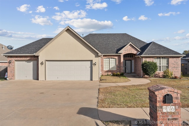 ranch-style home featuring a garage