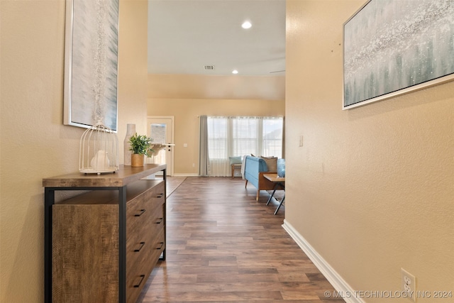 corridor featuring dark hardwood / wood-style flooring