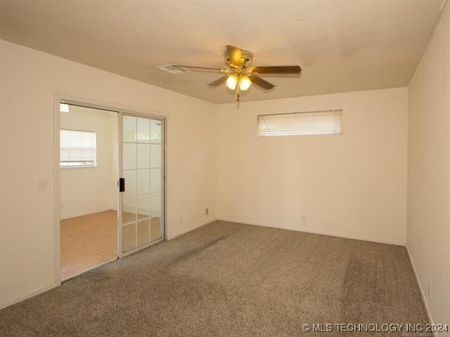 1132 W Florence Ct, Broken Arrow, OK 74011 - empty room with carpet floors, ceiling fan, and baseboards