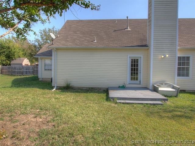 1132 W Florence Ct, Broken Arrow, OK 74011 - back of house with a chimney, a deck, and a shingled roof