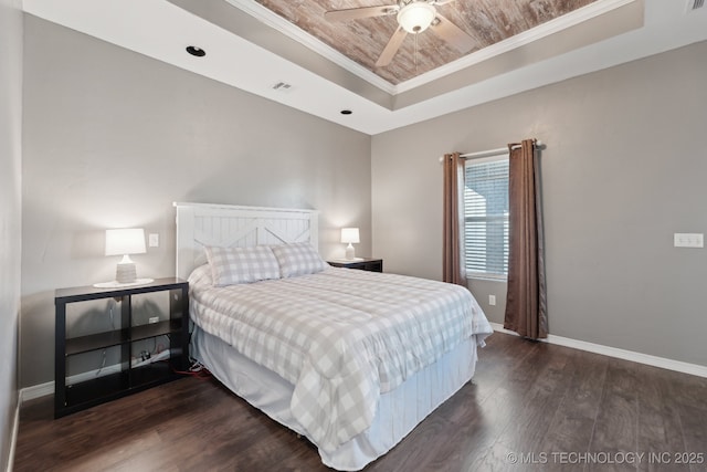 bedroom with crown molding, wooden ceiling, dark hardwood / wood-style flooring, and a tray ceiling