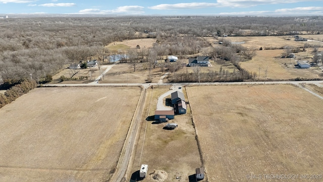 birds eye view of property with a rural view