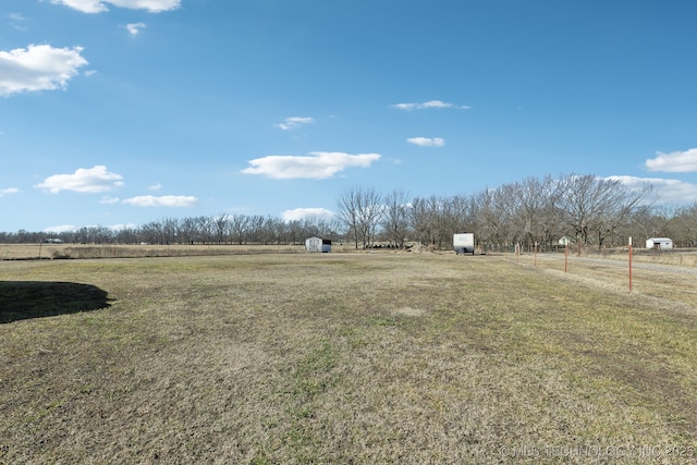 view of yard with a rural view