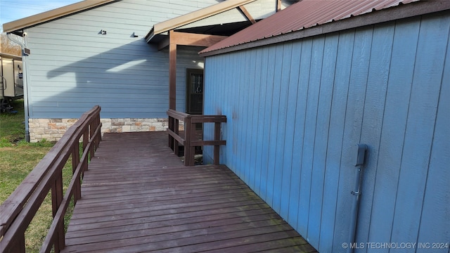 view of side of home with a deck