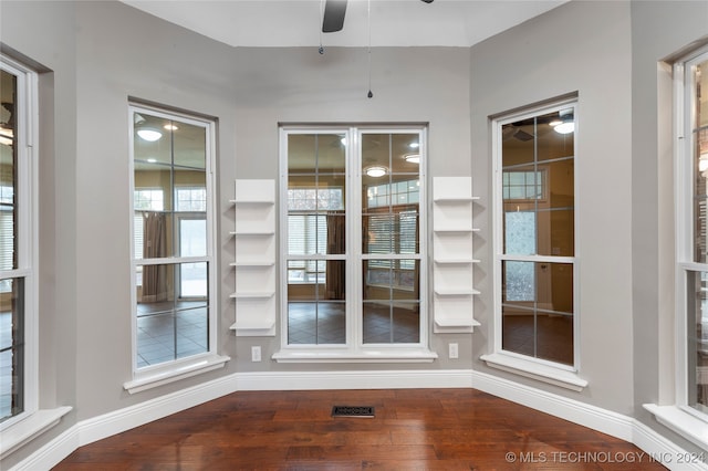 interior space with ceiling fan and hardwood / wood-style floors