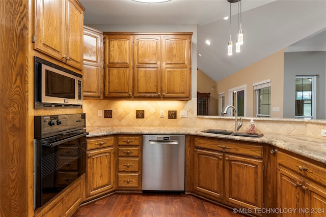 kitchen with sink, dark hardwood / wood-style flooring, backsplash, vaulted ceiling, and appliances with stainless steel finishes