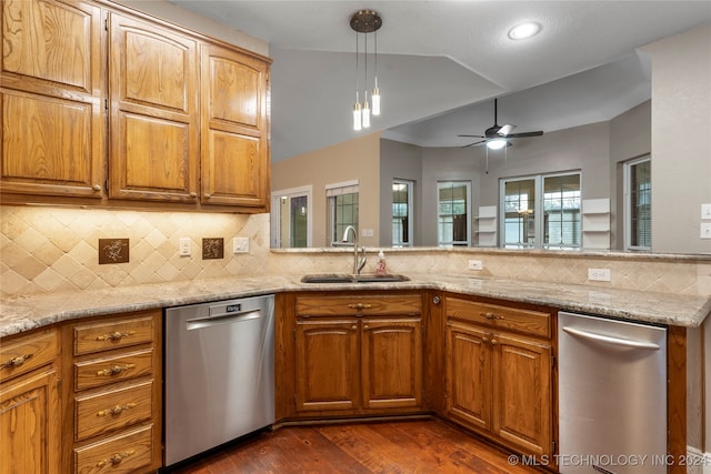 kitchen with light stone countertops, stainless steel dishwasher, ceiling fan, dark wood-type flooring, and sink