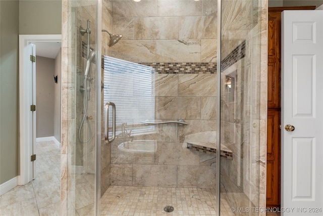 bathroom featuring tile patterned flooring and walk in shower