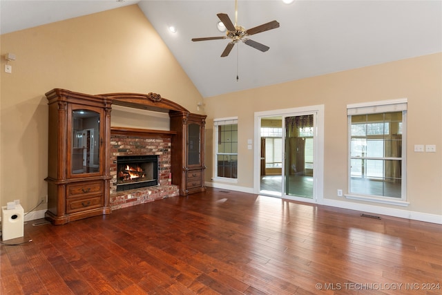 unfurnished living room featuring a fireplace, ceiling fan, dark hardwood / wood-style flooring, and high vaulted ceiling