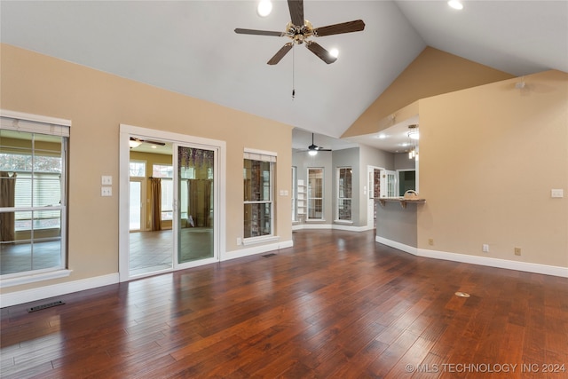 unfurnished living room with dark hardwood / wood-style flooring, high vaulted ceiling, and ceiling fan