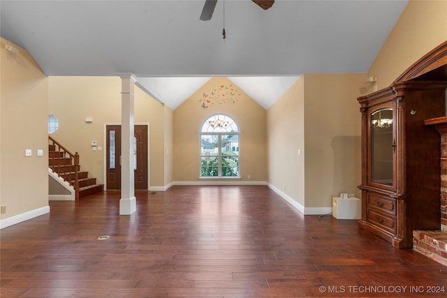 unfurnished living room with lofted ceiling, ornate columns, ceiling fan, and dark hardwood / wood-style floors