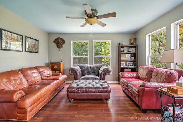 living room featuring dark hardwood / wood-style flooring and ceiling fan