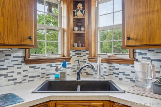 kitchen featuring backsplash and sink