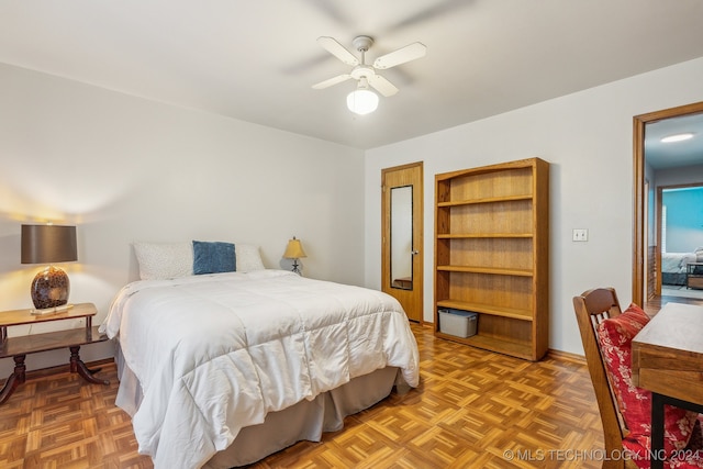 bedroom featuring parquet floors and ceiling fan