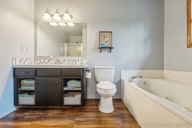 full bathroom featuring hardwood / wood-style floors, vanity, toilet, and shower with separate bathtub