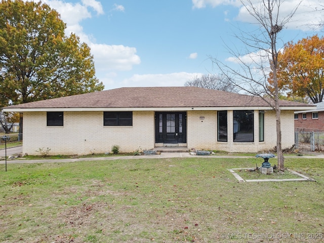 ranch-style house featuring a front lawn