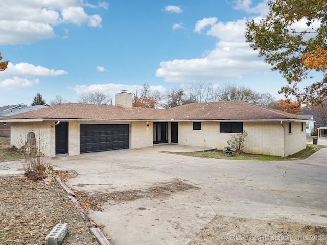 single story home with a garage