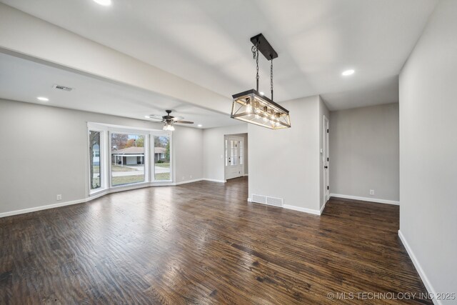 corridor with dark hardwood / wood-style flooring