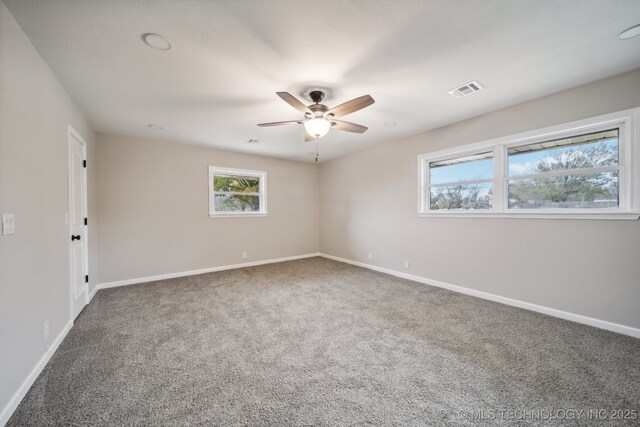 carpeted empty room with ceiling fan