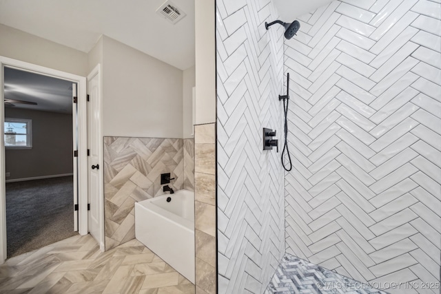 bathroom with tile walls and plus walk in shower