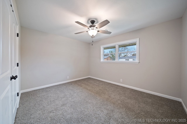 carpeted empty room with ceiling fan