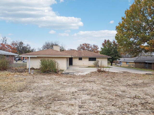 rear view of property featuring a patio area