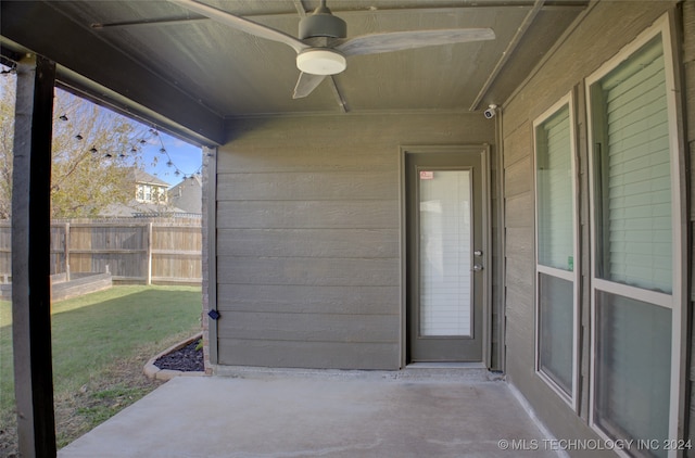 exterior space with ceiling fan