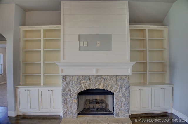 room details featuring a fireplace and hardwood / wood-style floors