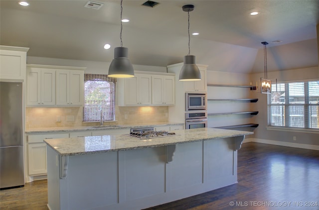 kitchen featuring white cabinets, a healthy amount of sunlight, and appliances with stainless steel finishes