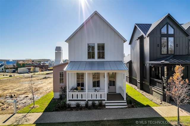 modern farmhouse featuring covered porch