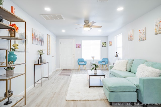 living room with ceiling fan and light hardwood / wood-style floors