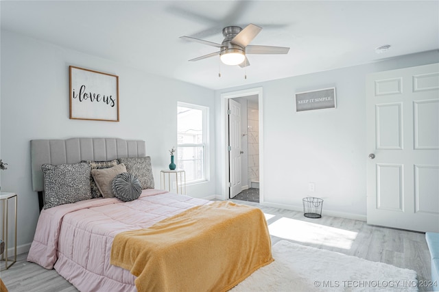 bedroom with connected bathroom, light hardwood / wood-style floors, and ceiling fan