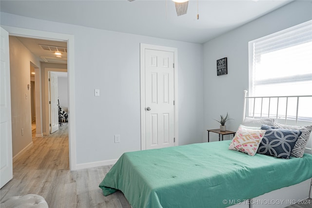 bedroom featuring ceiling fan and light hardwood / wood-style floors