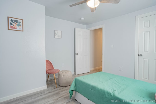 bedroom featuring light hardwood / wood-style floors and ceiling fan