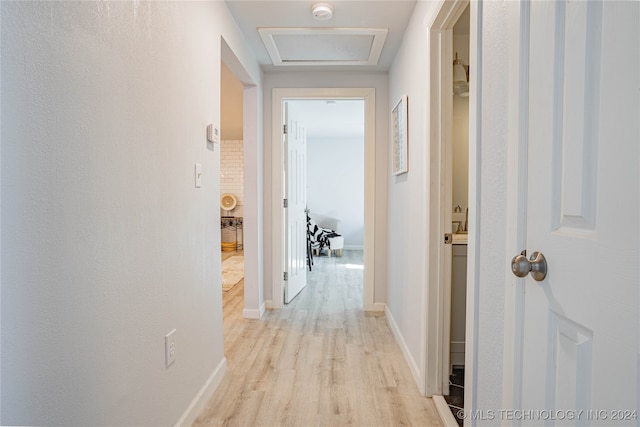 hall with light hardwood / wood-style flooring