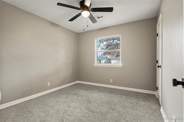 empty room with carpet flooring and ceiling fan