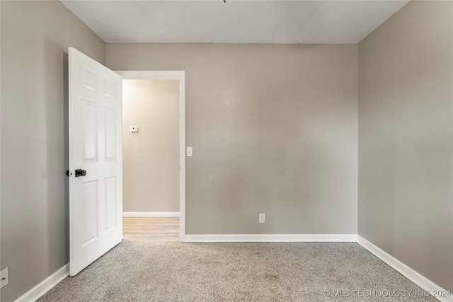 unfurnished room featuring carpet flooring