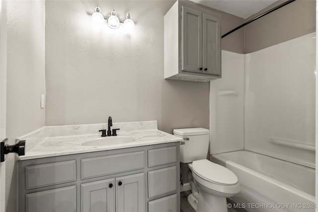 full bathroom featuring shower / bathing tub combination, vanity, and toilet