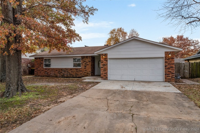 ranch-style home featuring a garage