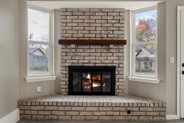 room details featuring a brick fireplace