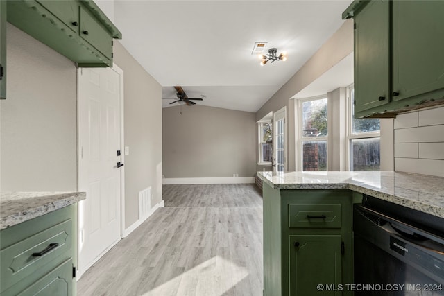 kitchen featuring kitchen peninsula, vaulted ceiling, and green cabinetry