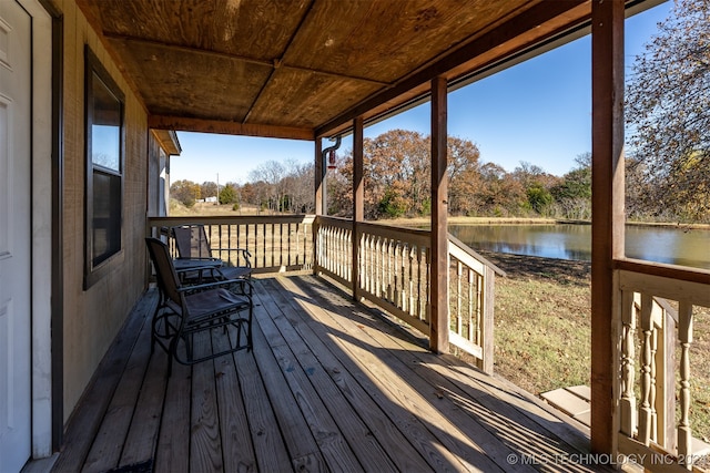 wooden terrace with a water view