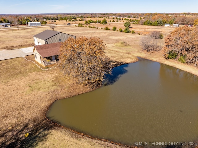 drone / aerial view with a rural view and a water view