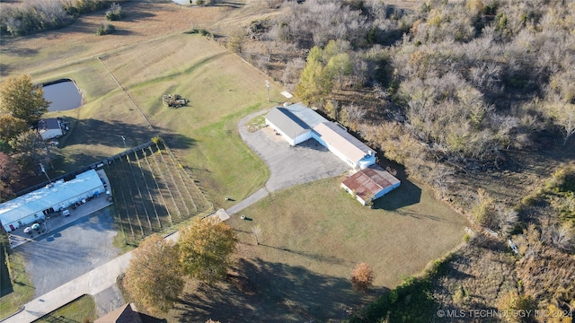 birds eye view of property with a rural view