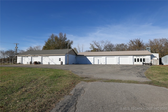 garage with a lawn