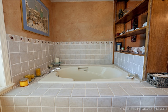 bathroom featuring tiled bath